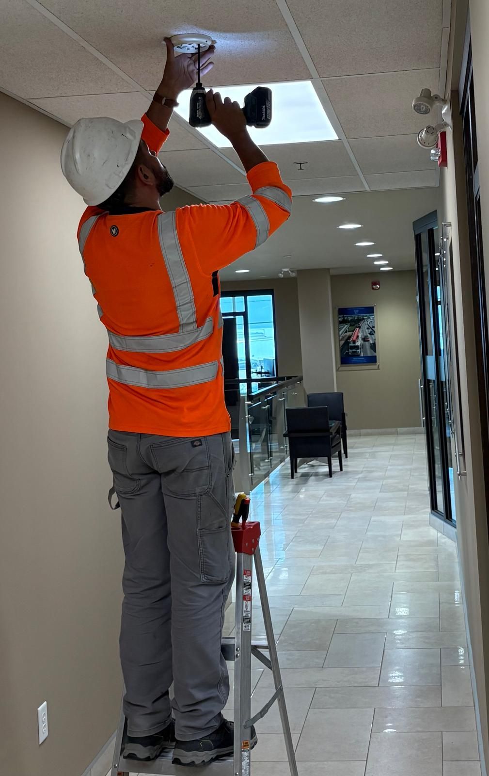 Fire alarm device testing by Edmonton commercial electrician