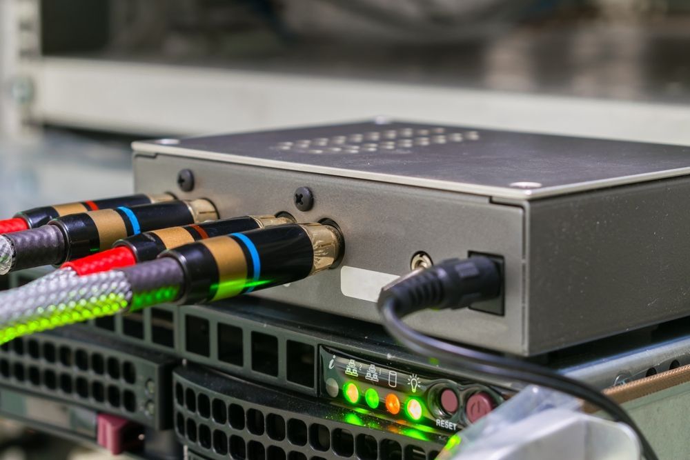 A Close Up Of A Box With Cables Plugged Into It — Country to Coast Cabling in Rockhampton, QLD