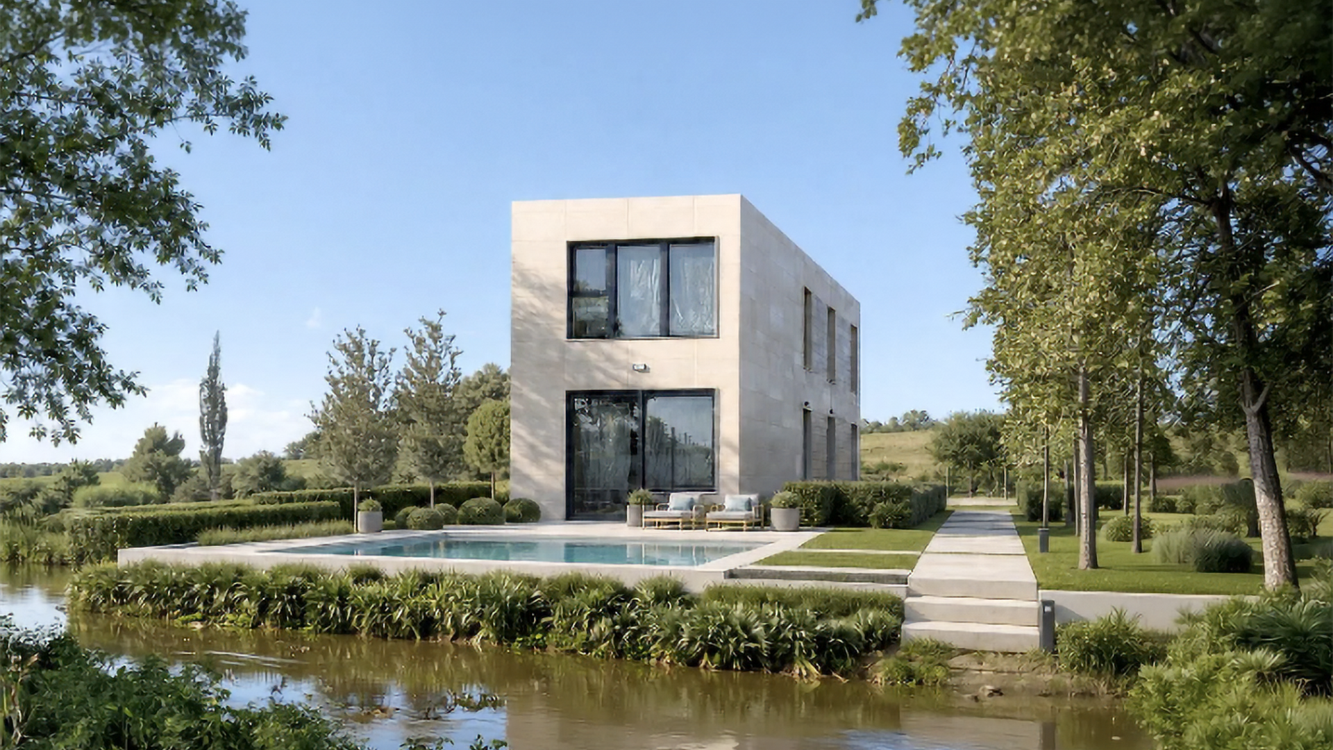 Moderna casa de piedra de dos plantas con grandes ventanales junto a un estanque reflectante y un jardín paisajístico bajo un cielo despejado.