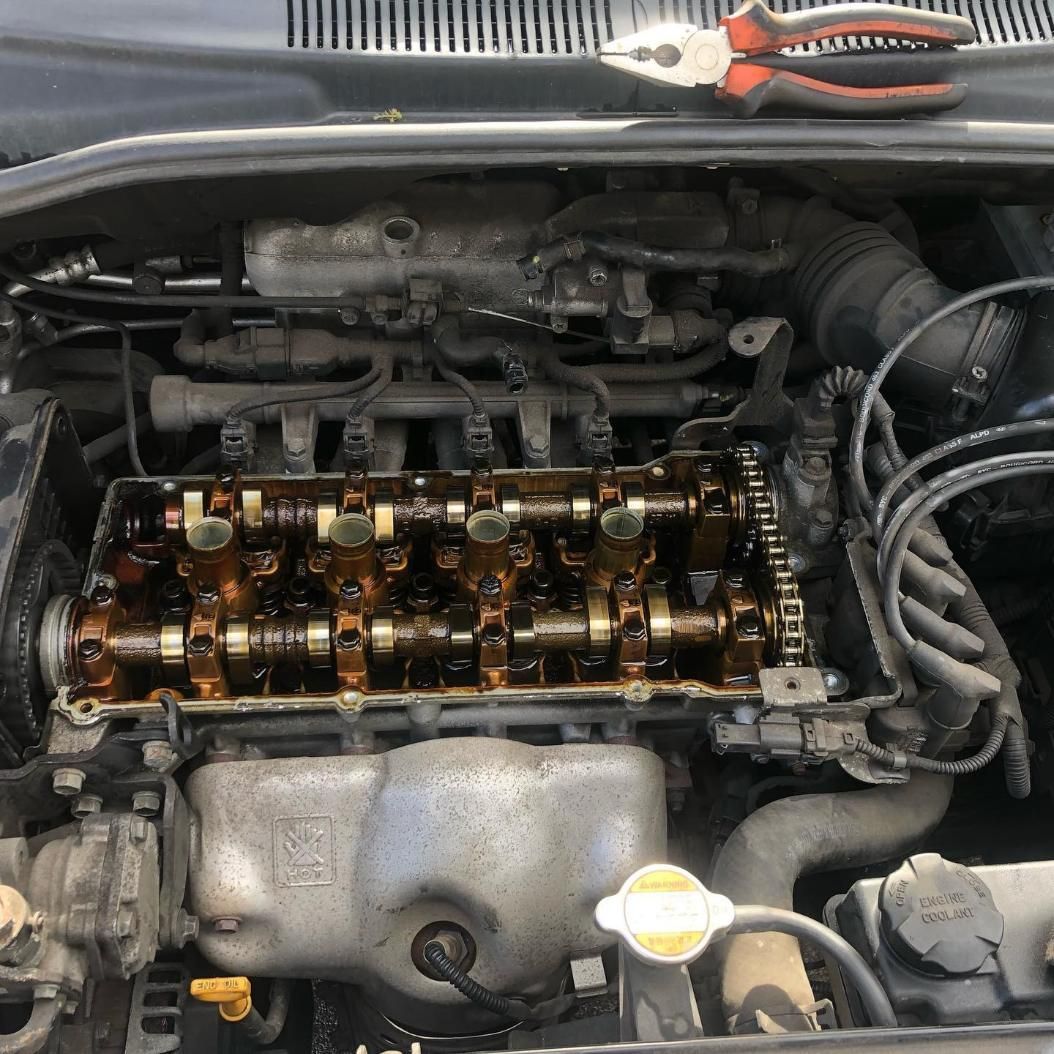 A Car Engine With A Pair Of Pliers On Top Of It — SG Mobile Mechanic In Newcastle, NSW