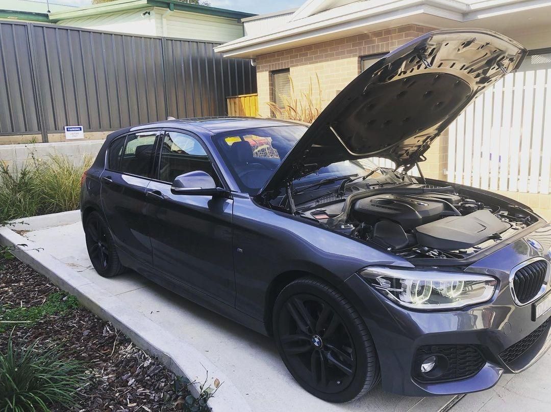 A BMW With Its Hood Open Is Parked In Front Of A House — SG Mobile Mechanic In Newcastle, NSW