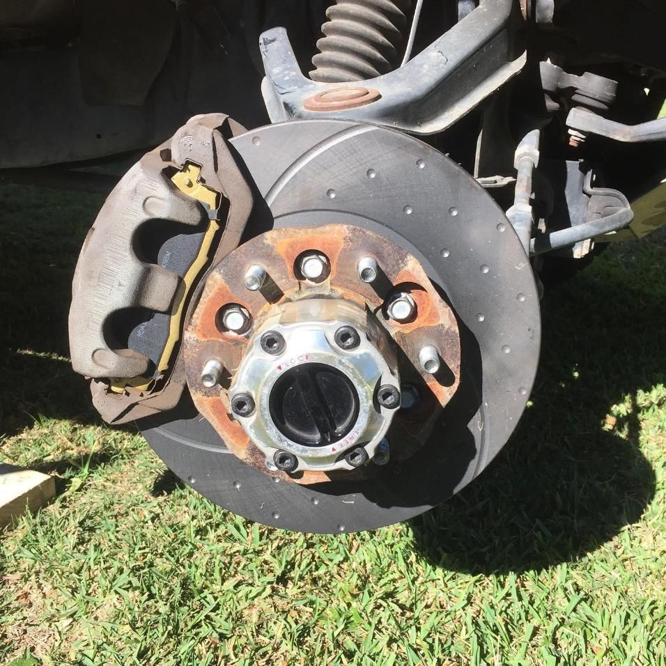 A Close Up Of A Brake Disc On A Car — SG Mobile Mechanic In Newcastle, NSW