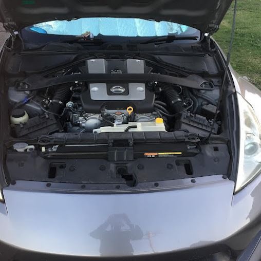 The Hood Of A Car Is Open And The Engine Is Visible — SG Mobile Mechanic In Newcastle, NSW