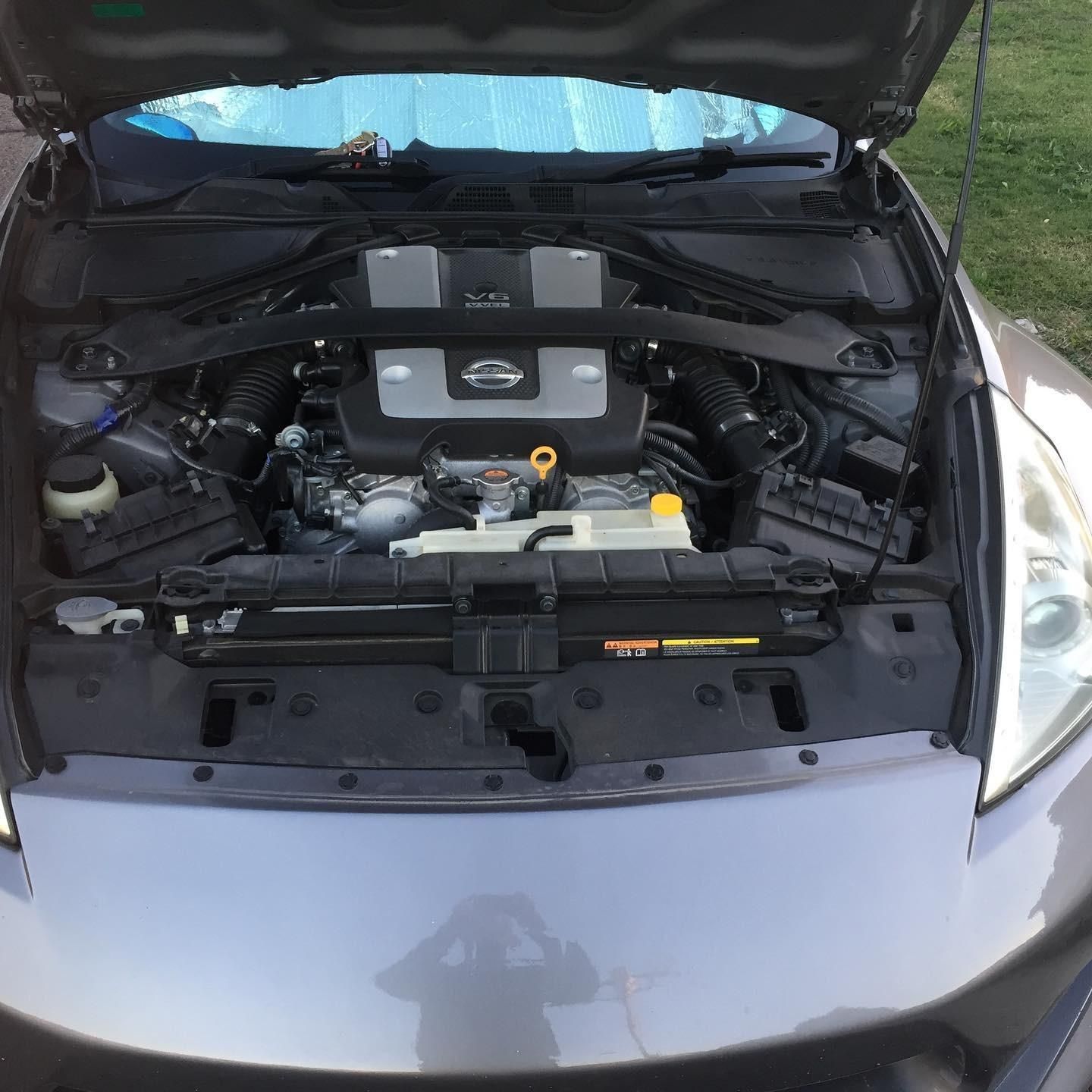 The Engine Of A Car Is Shown With The Hood Open — SG Mobile Mechanic In Newcastle, NSW