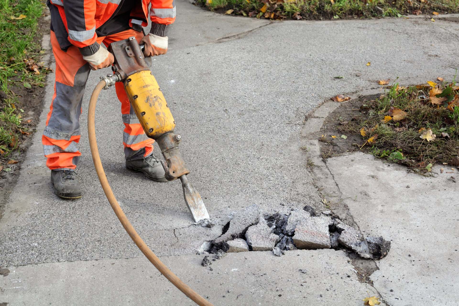 Cracked concrete paving being broken apart for easier repair in Rancho Cucamonga