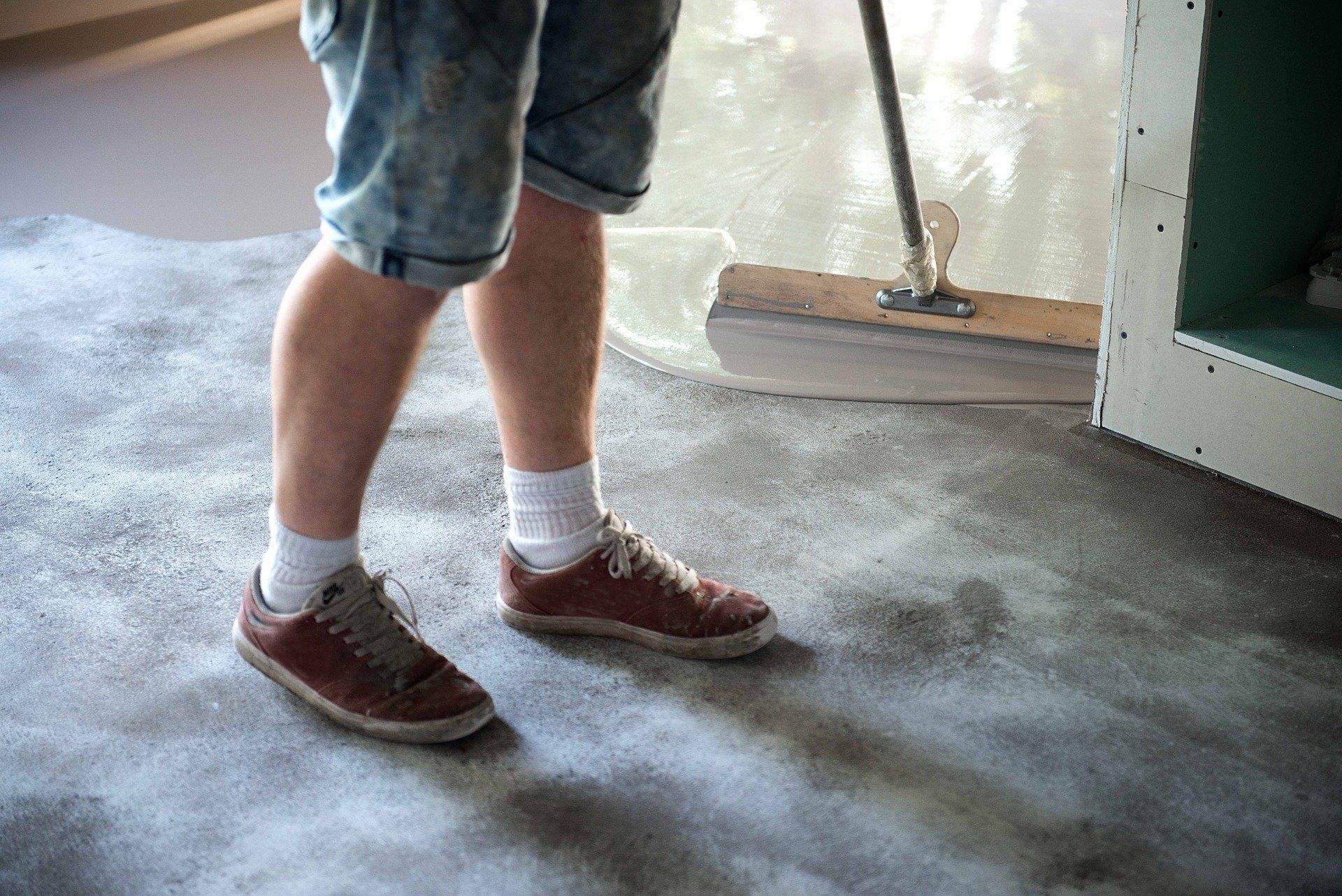 Epoxy floor coating being laid in garage in Rancho Cucamonga California