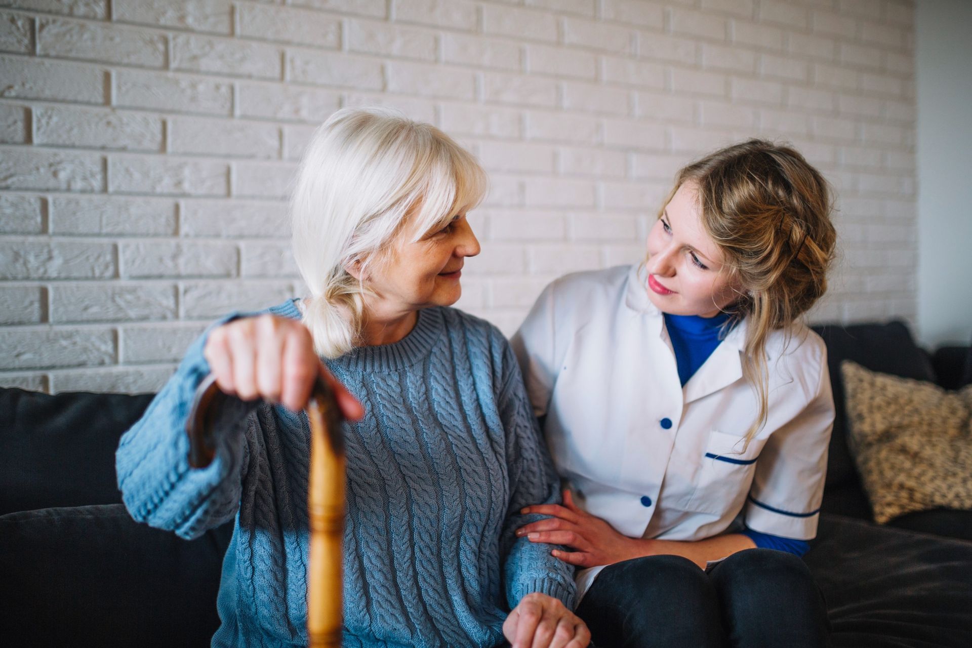 Senior woman receiving in-home care assistance from caregiver in Southern California