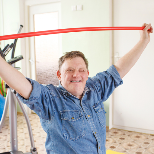 Man stretching out a flex band