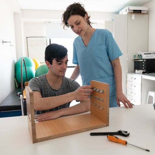 Occupational therapist training young man