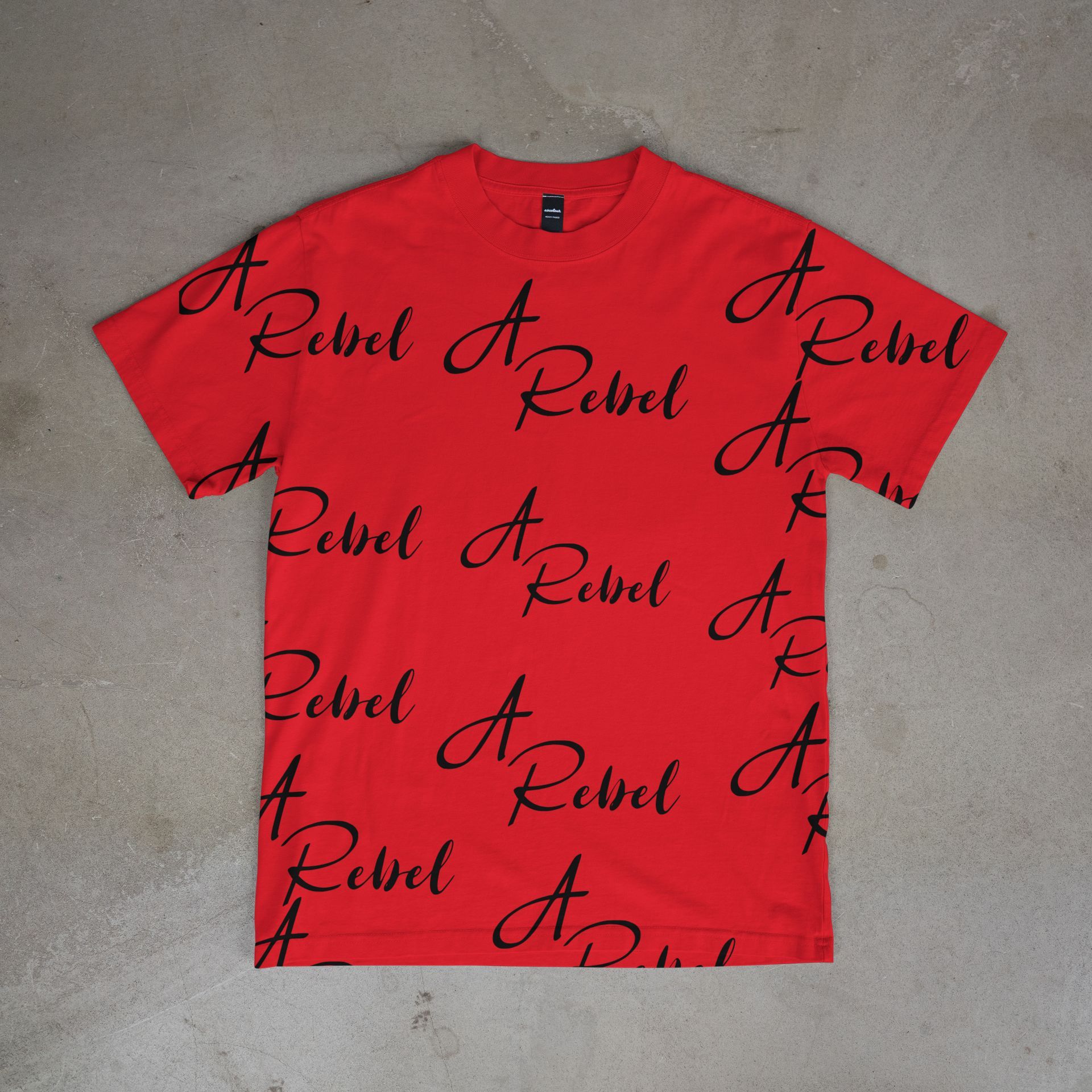 green t-shirt with black cursive with A Rebel all over front and back