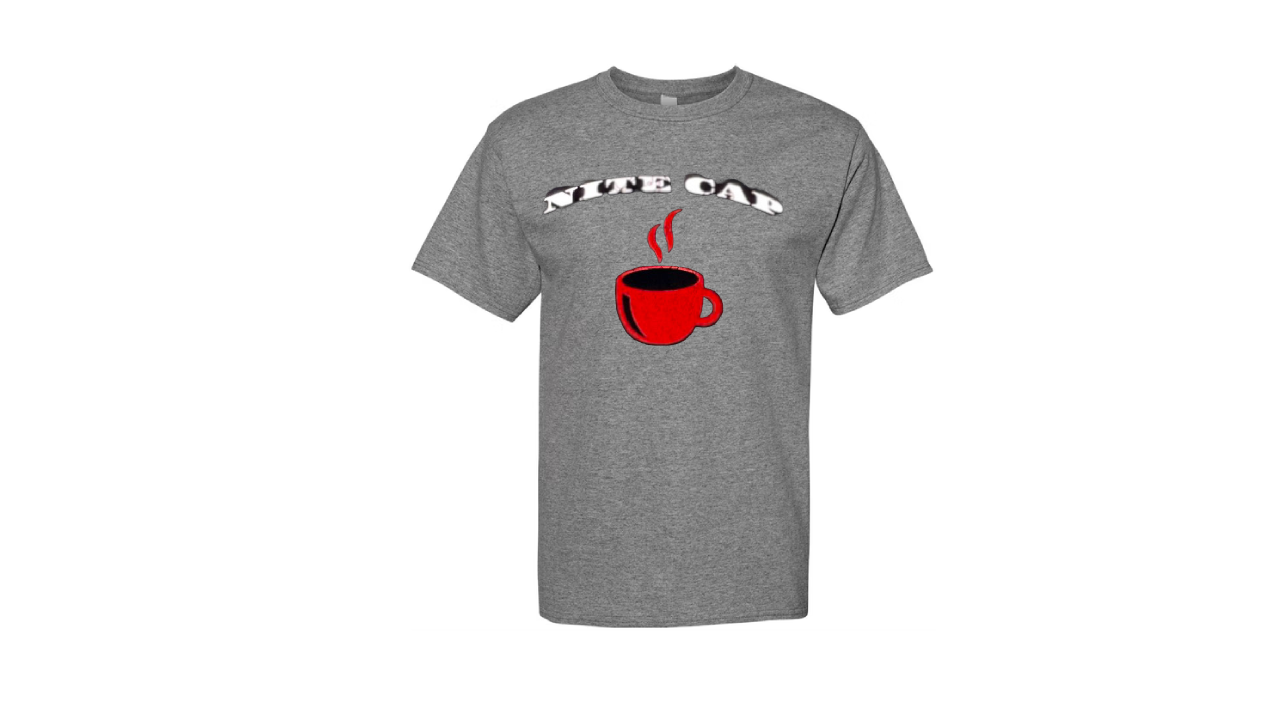 A white t-shirt with a steaming red cup of coffee on it.