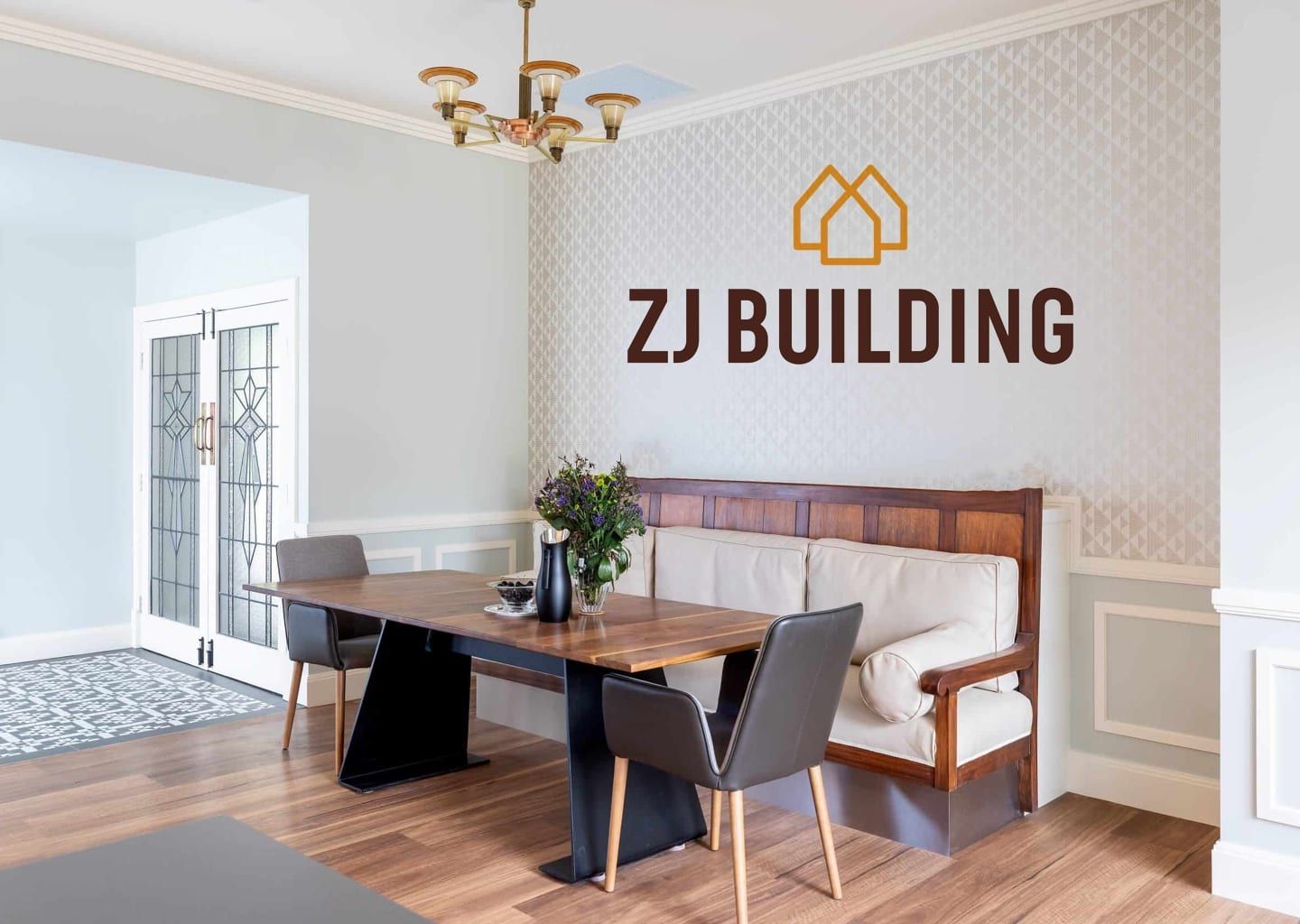 A dining room with a table and chairs and a sign on the wall that says zj building.