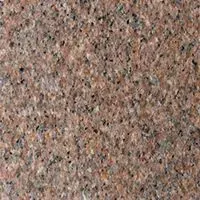 A close up of a brown granite counter top.