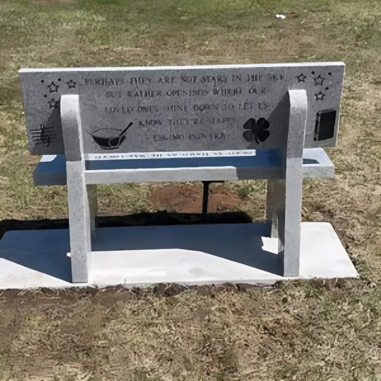 A bench with a quote on it that says 