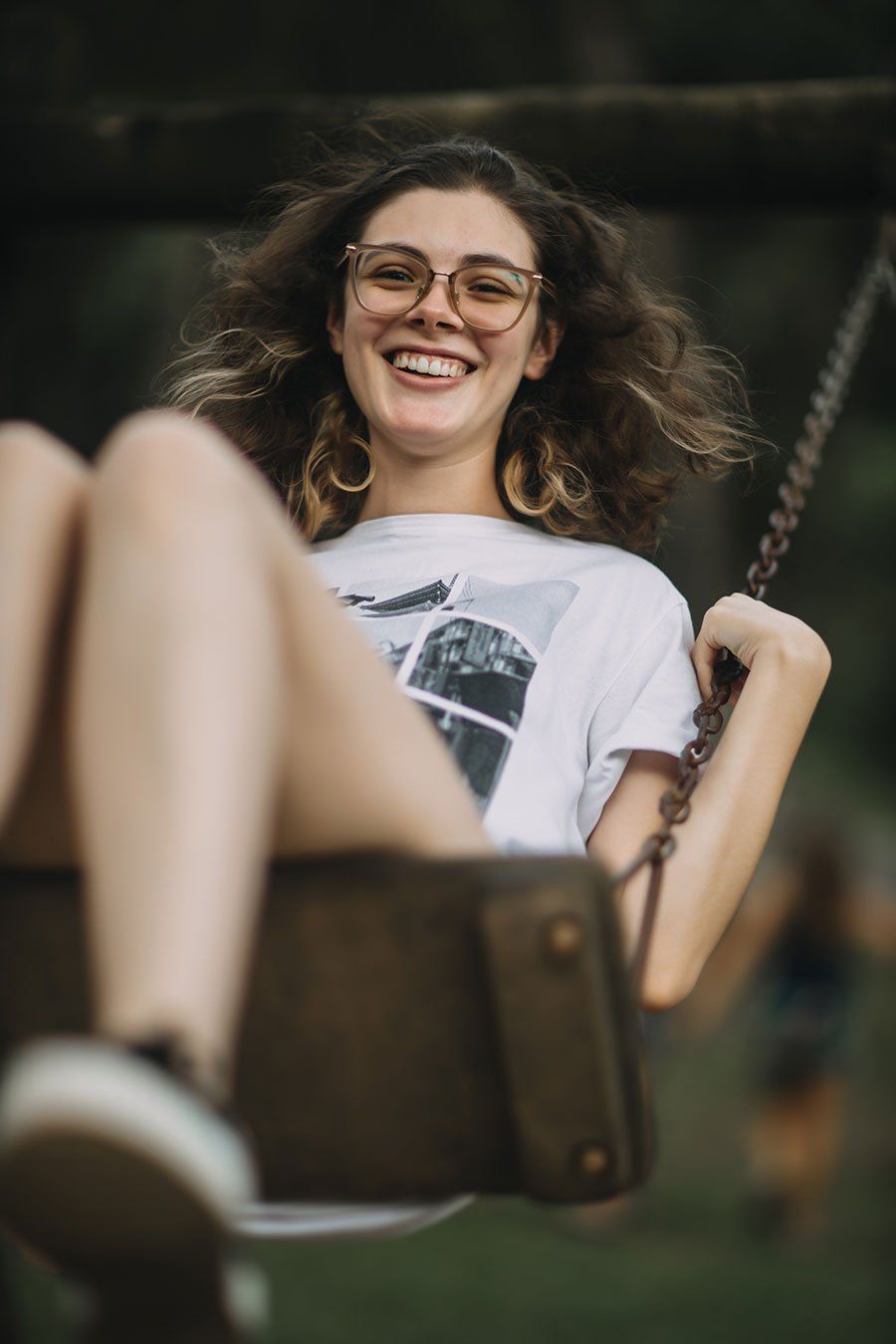 a happy lady on a swing Truth Tara™