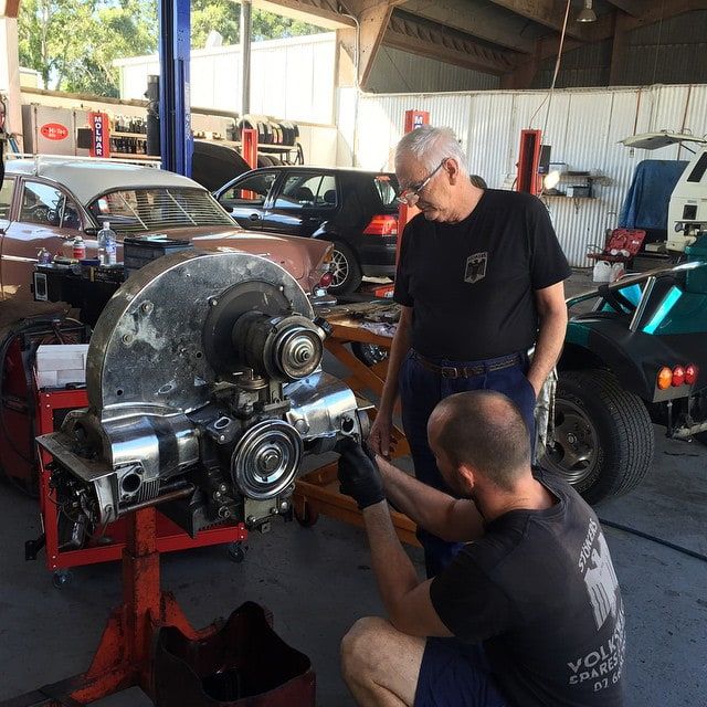 A Man Wearing a Black Shirt That Says Volkswagen on It — Stokers VW Mechanical Servicing & Repairs in Byron Bay, NSW