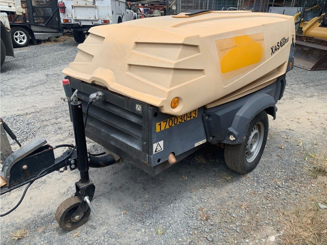 Two Air Compressors Are Parked Next To Each Other In A Parking Lot — Eclipse Hire In  Tablelands, QLD