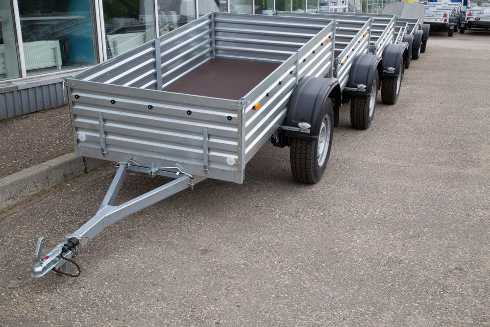 A Row Of Trailers Are Parked In A Parking Lot — Eclipse Hire In  Tablelands, QLD