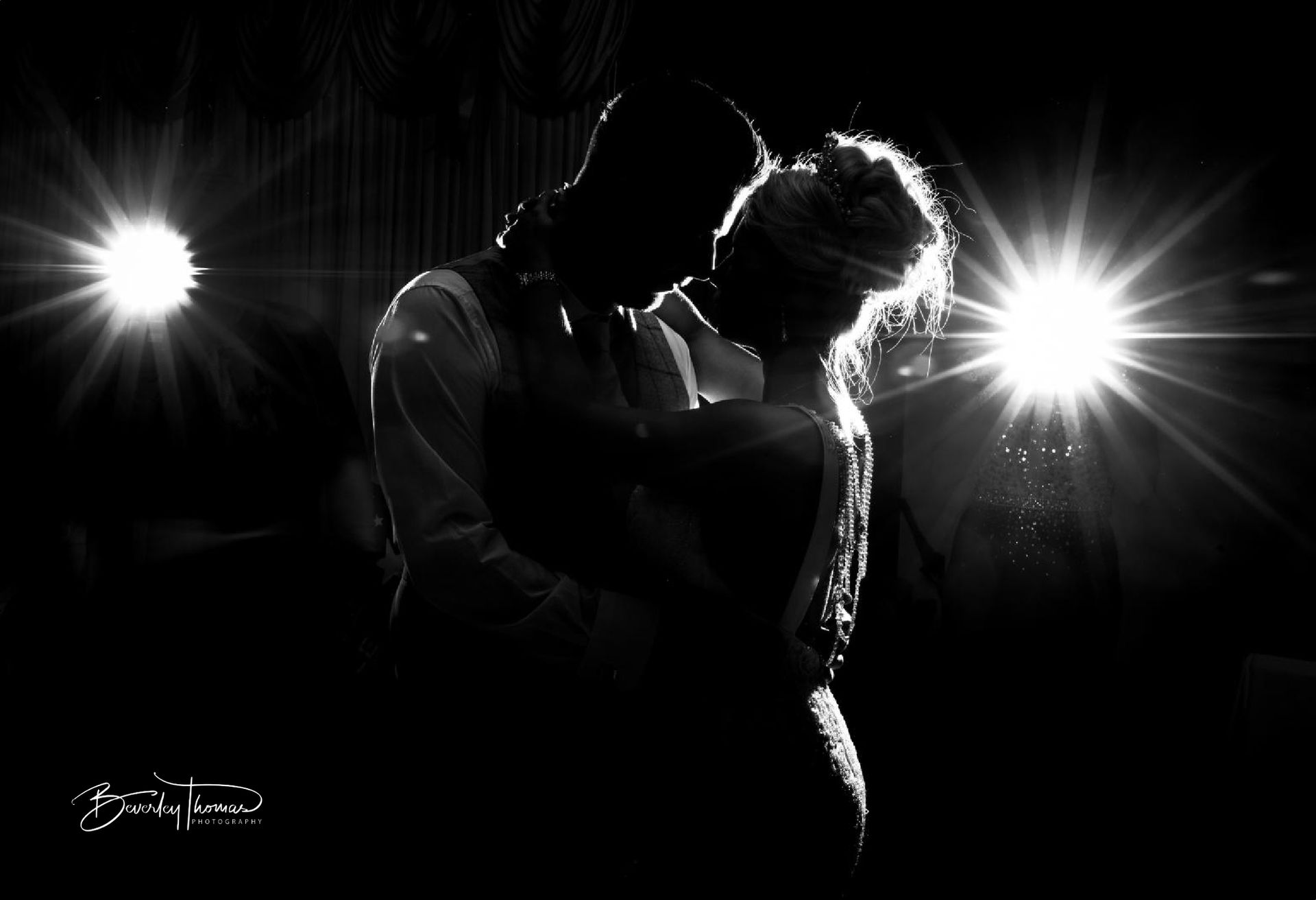Bide & Groom silhouetted during their snowy Pembrokeshire wedding reception at The De Valence