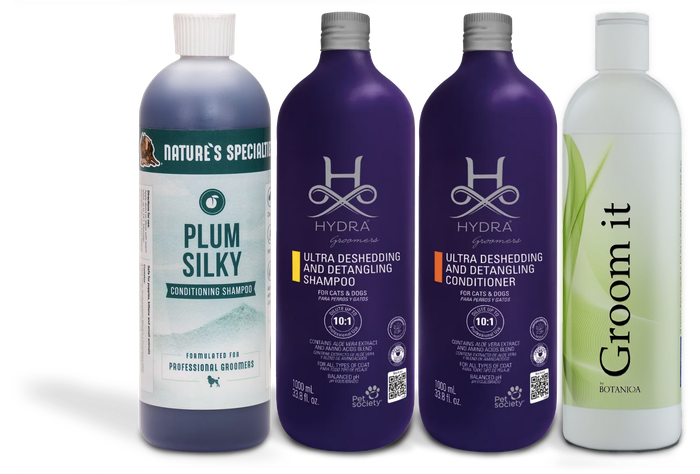 Four haircare bottles: one white and teal Plum Silky, two purple bottles, and one white Green It bottle