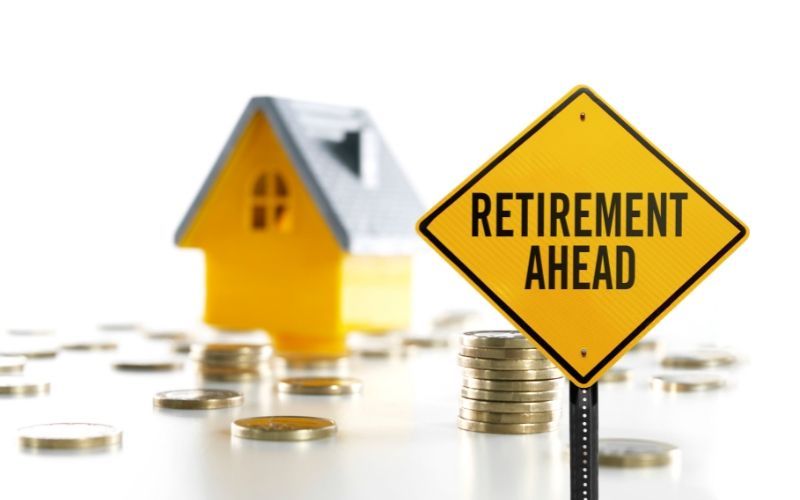 An image of a signboard symbolizing the financial stability if you pay off debt before retirement