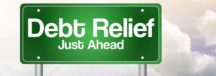 An image of a green sign that says debt relief just ahead.
