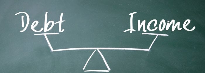 a blackboard with the words debt and income written on it emphasizing the idea of Lower Your Debt-to-Income Ratio
