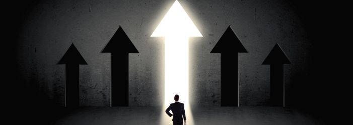 a man is standing in front of four arrows pointing up emphasizing the idea of Choosing The Right Option For Financial Relief