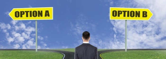 A man standing at a crossroads looking at two signs that say option A and Option B emphasizing the idea of What Are Your Options If You Can't Pay Taxes?