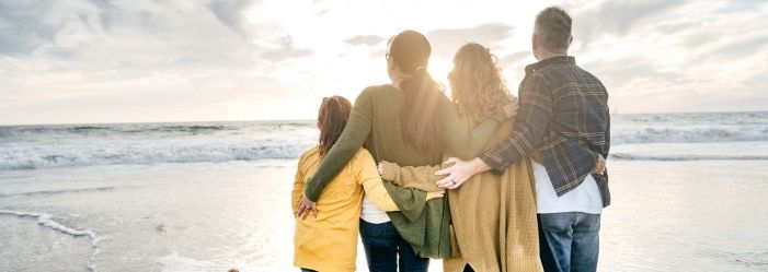 The image of a joyful family enjoying quality time together symbolizes the successful balance of a fulfilling lifestyle and smart financial management. Integrating everyday savings into family life without compromising on happiness and well-being.