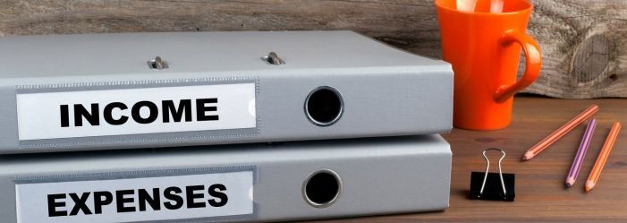 Close-up image of a folder labeled “Income & Expenses.