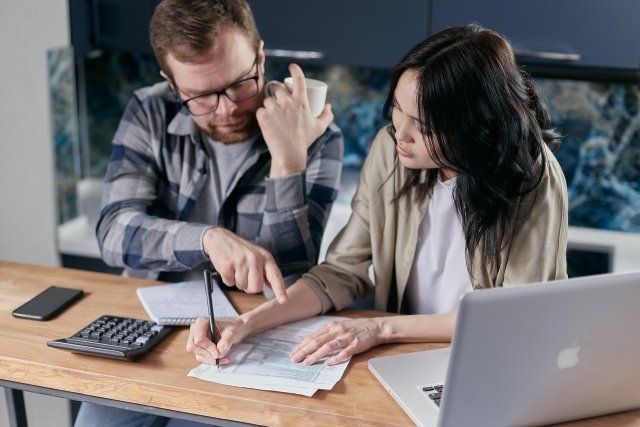 How to Deal With Your Spouses Debt Article Image