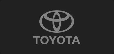 Toyota logo in gray on a dark background