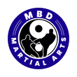 MBD Martial Arts logo with blue ring and black-and-white martial arts silhouette