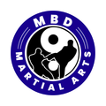 MBD Martial Arts logo with blue ring and black-and-white martial arts silhouette