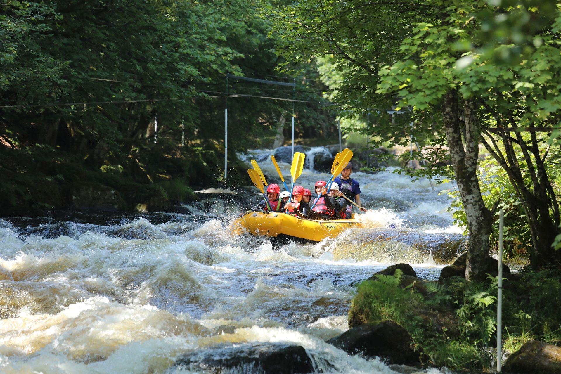 Rafting on a wild river with continuous whitewater rapids at Canolfan Tryweryn