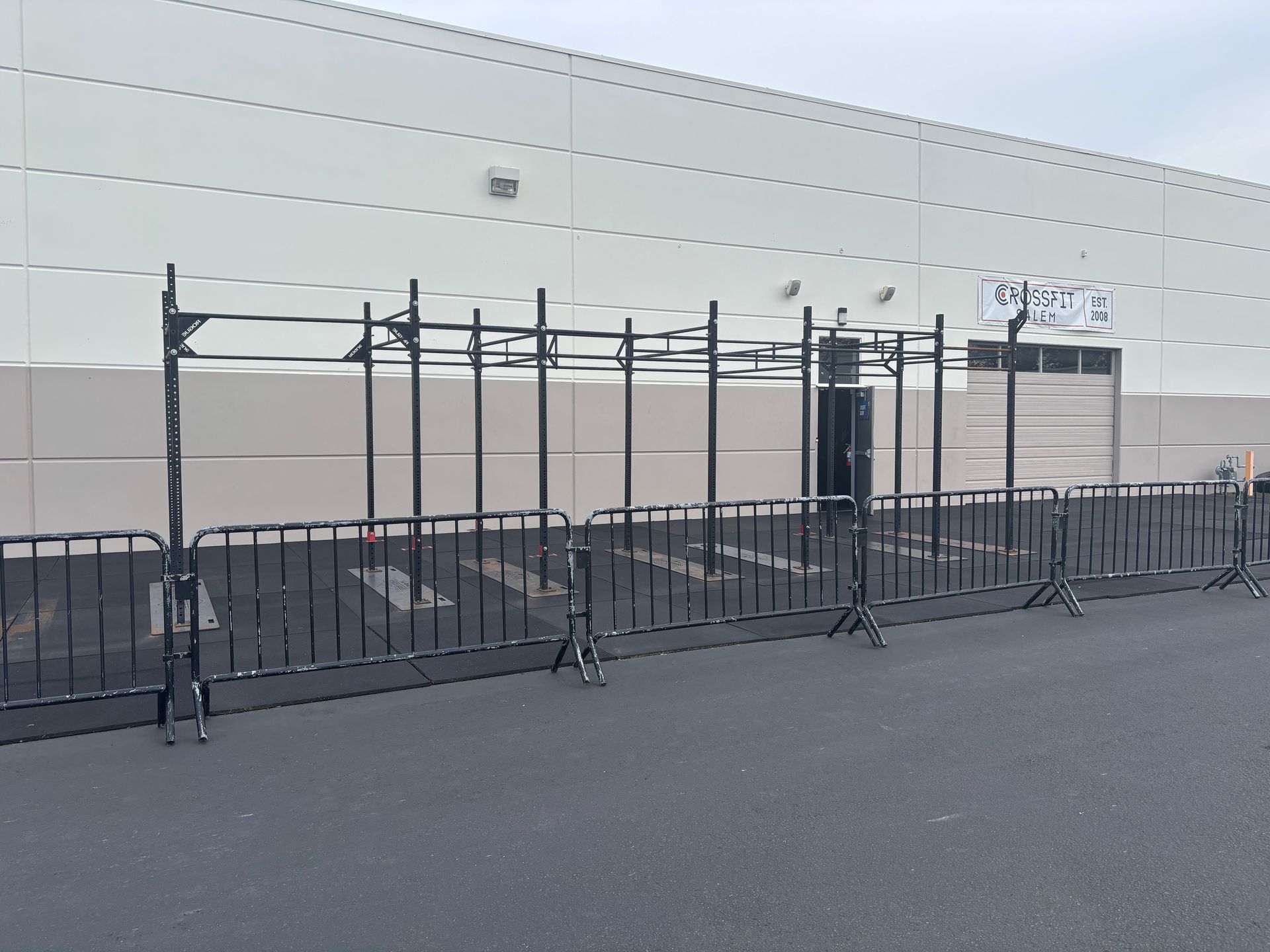 A large white building with a fence around it