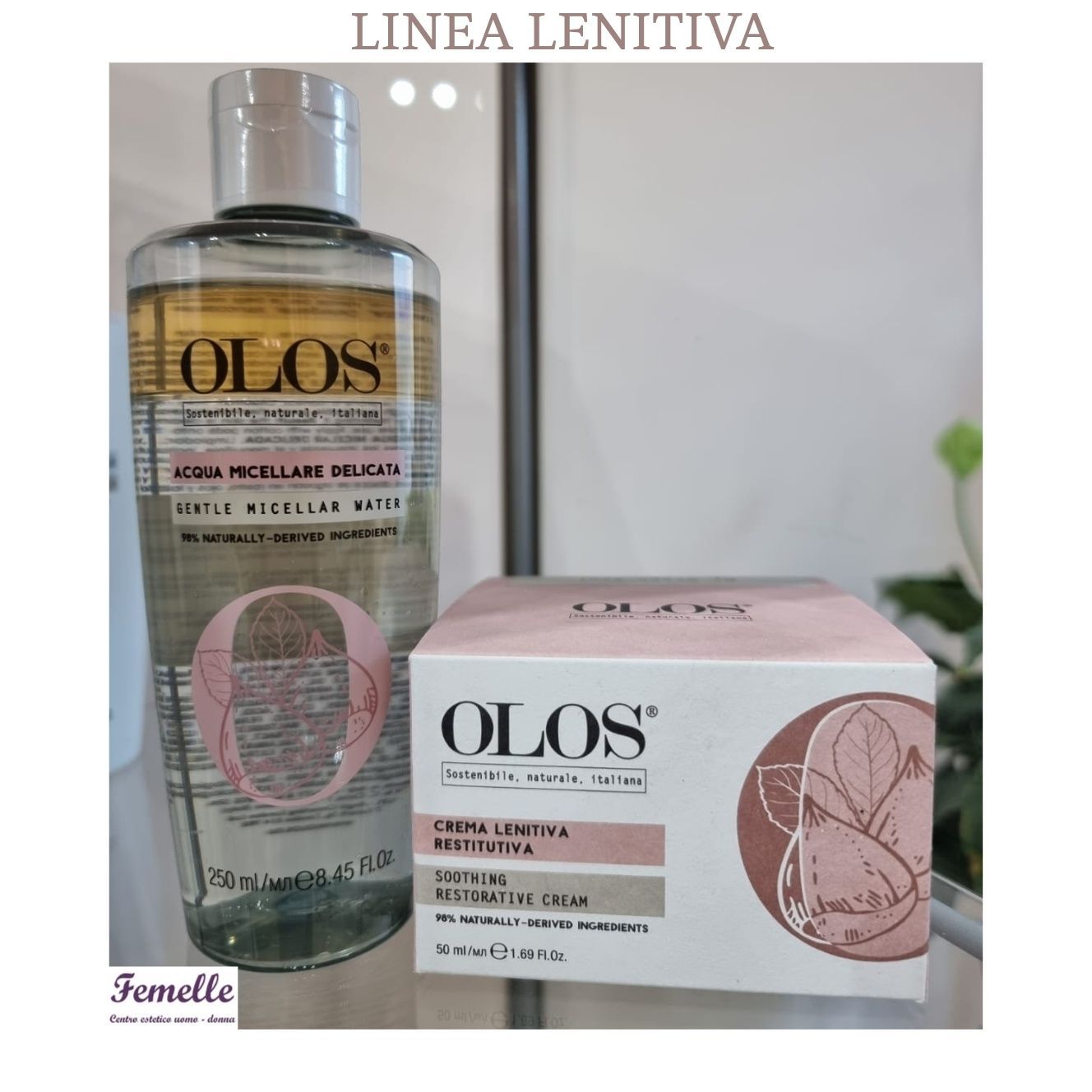 Flacone e scatola rosa del prodotto per la cura della pelle OLOS Linea Lenitiva su una superficie bianca.