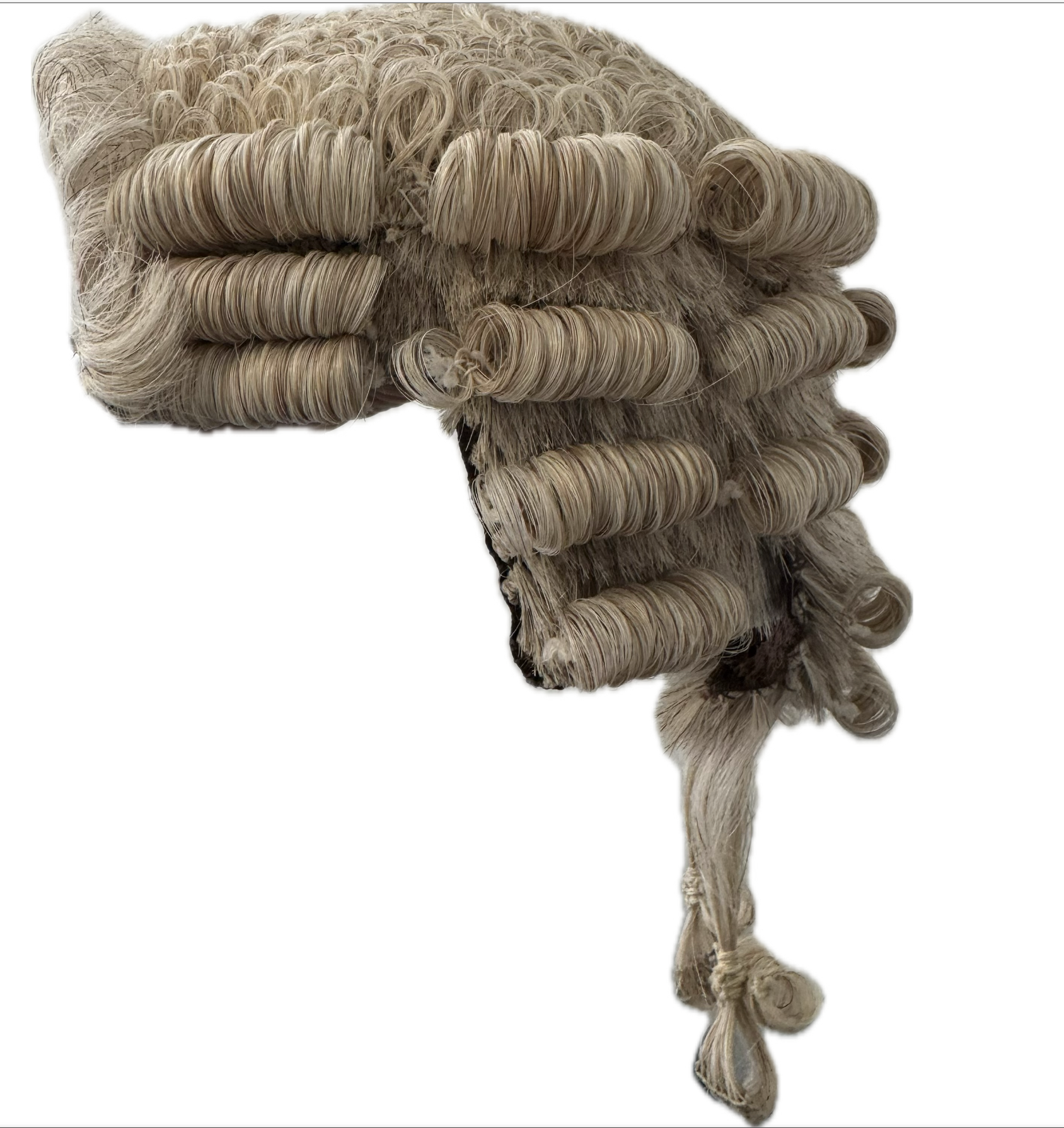 A close up of a wig on a white background