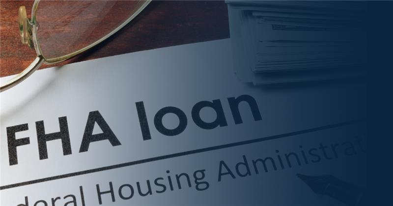 A document titled FHA loan, referring to the Federal Housing Administration, partially covered by eyeglasses.