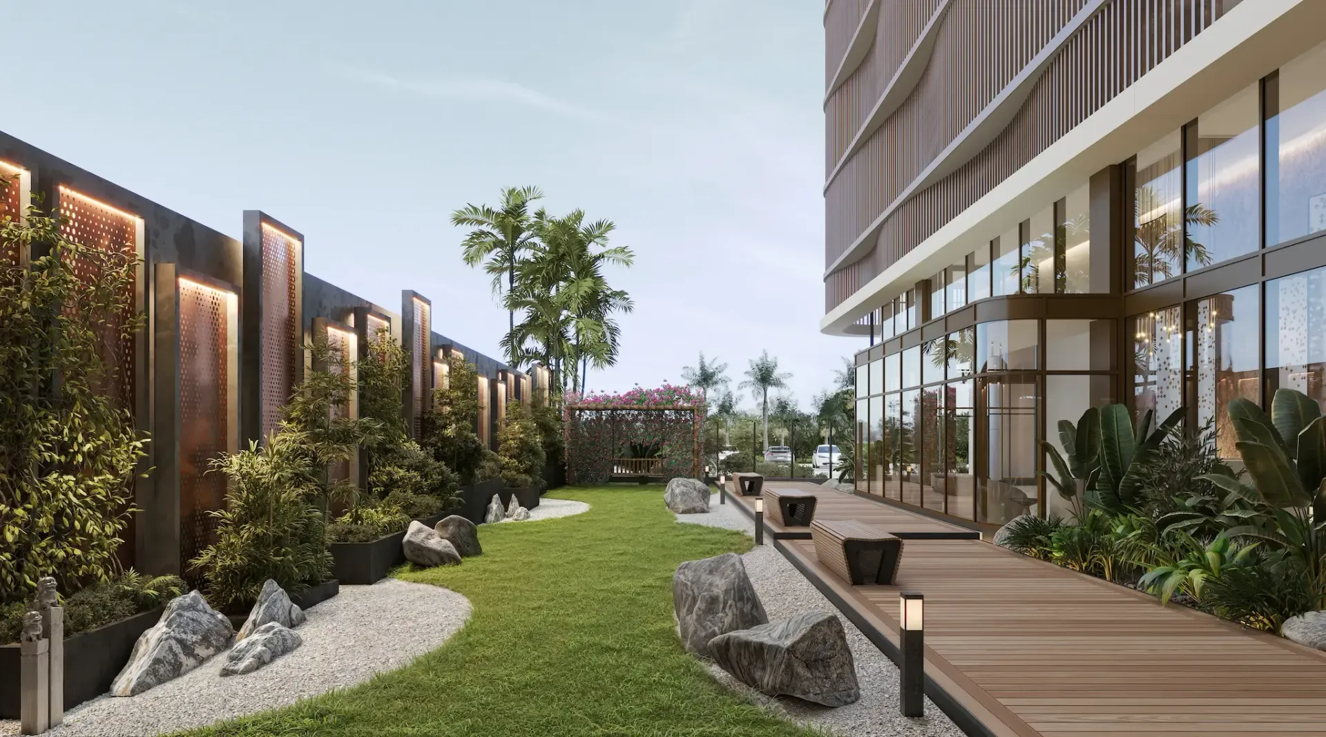 Modern landscaped courtyard between apartment buildings with lawn, wooden deck, and greenery