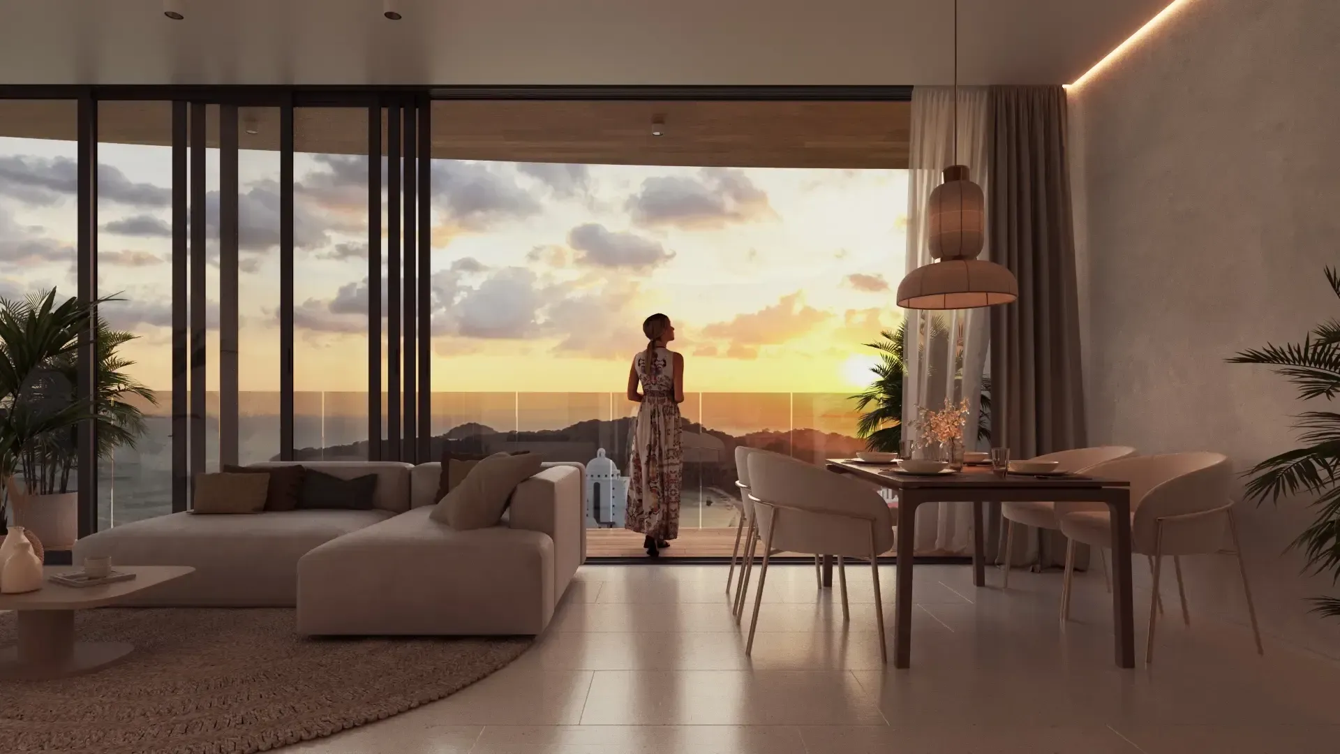 Modern living room at sunset with open glass walls, neutral furniture, and two people near the dining table.