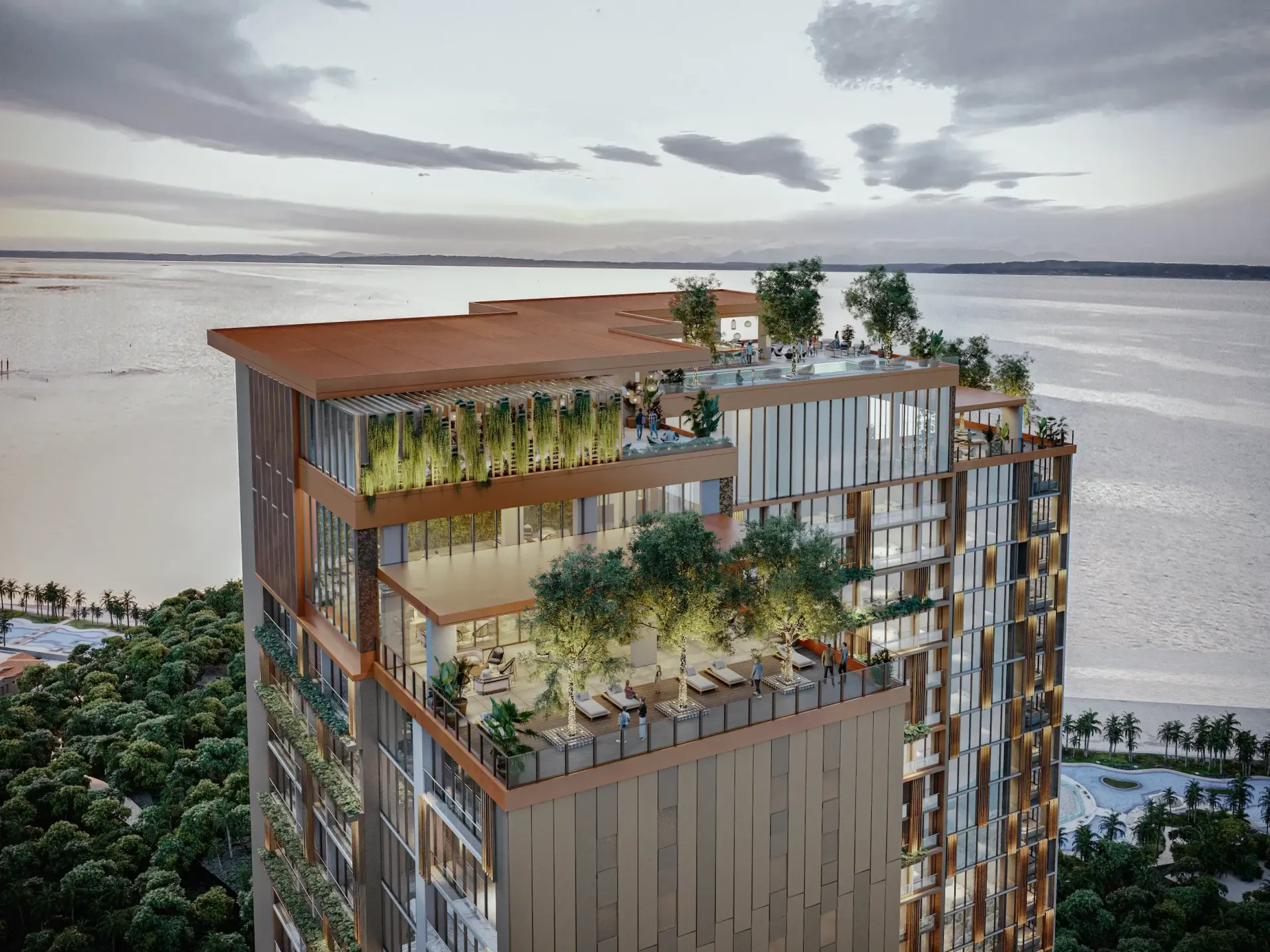Immeuble moderne en bord de mer, avec des jardins sur le toit, au bord d’une baie paisible au coucher du soleil