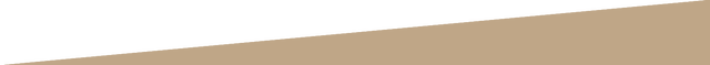 A close up of a yellow triangle on a white background.