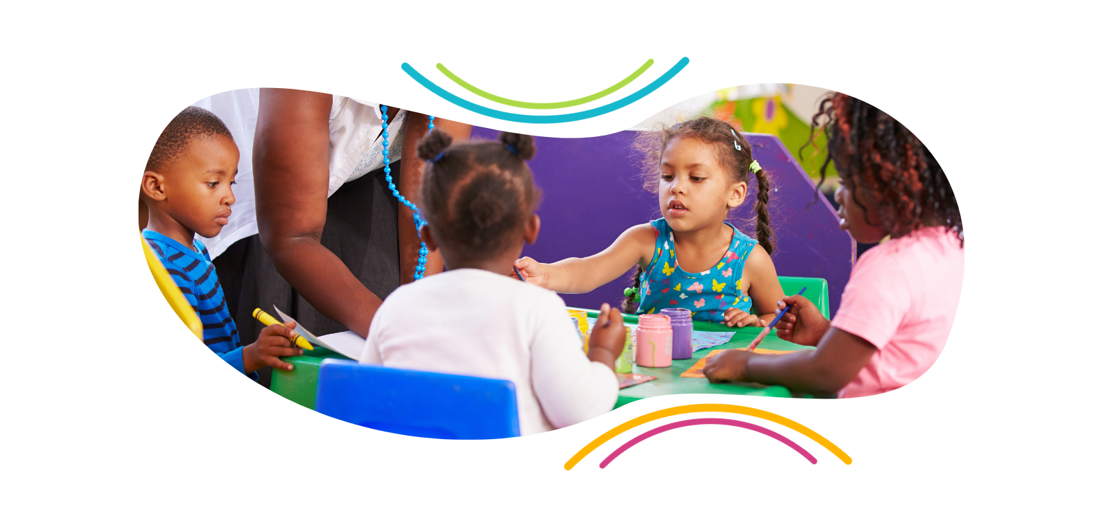 a group of children are sitting around a table playing with toys .
