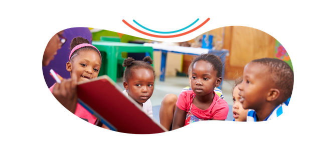 a group of children are sitting around a teacher reading a book .