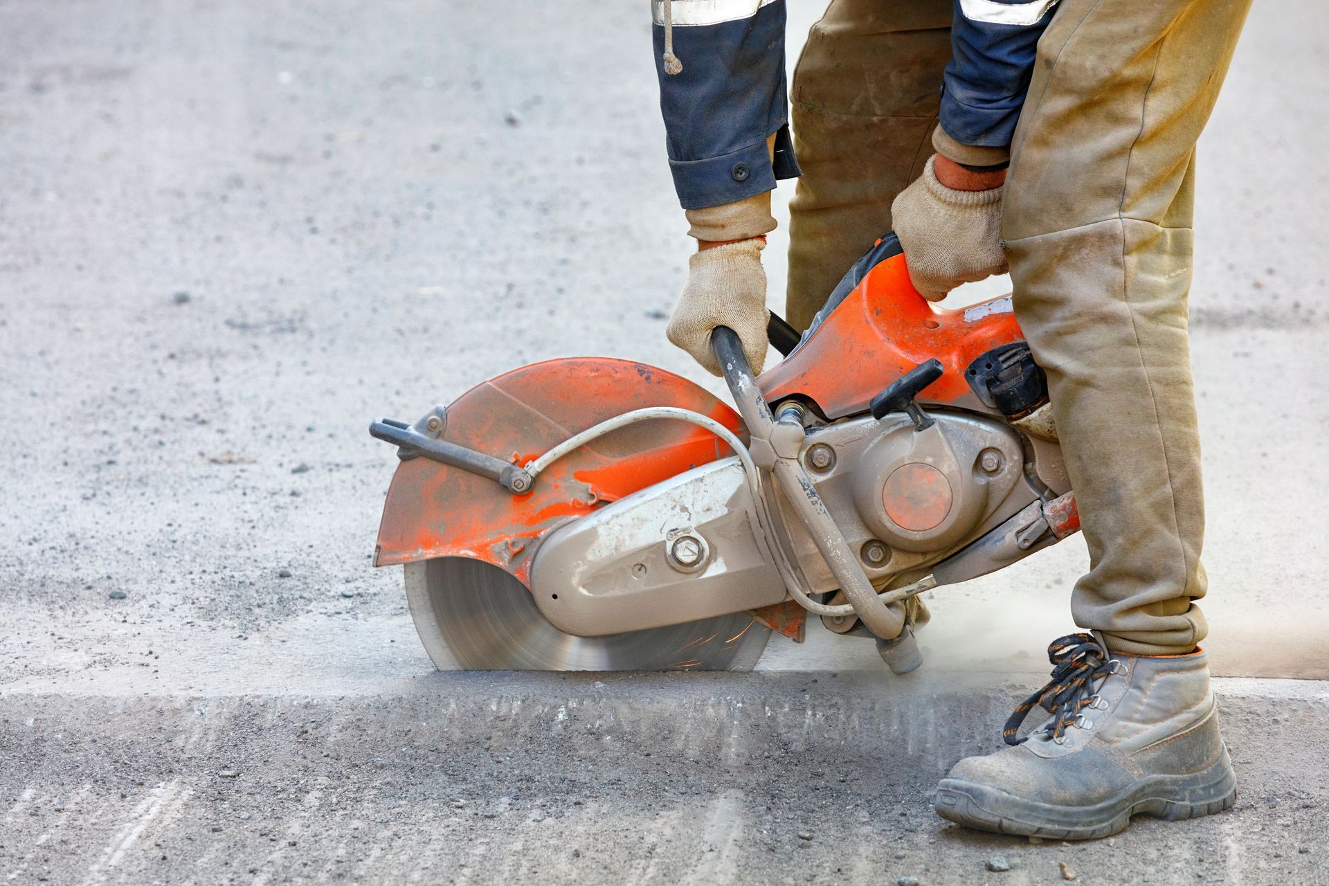 worker mends part road cuts out