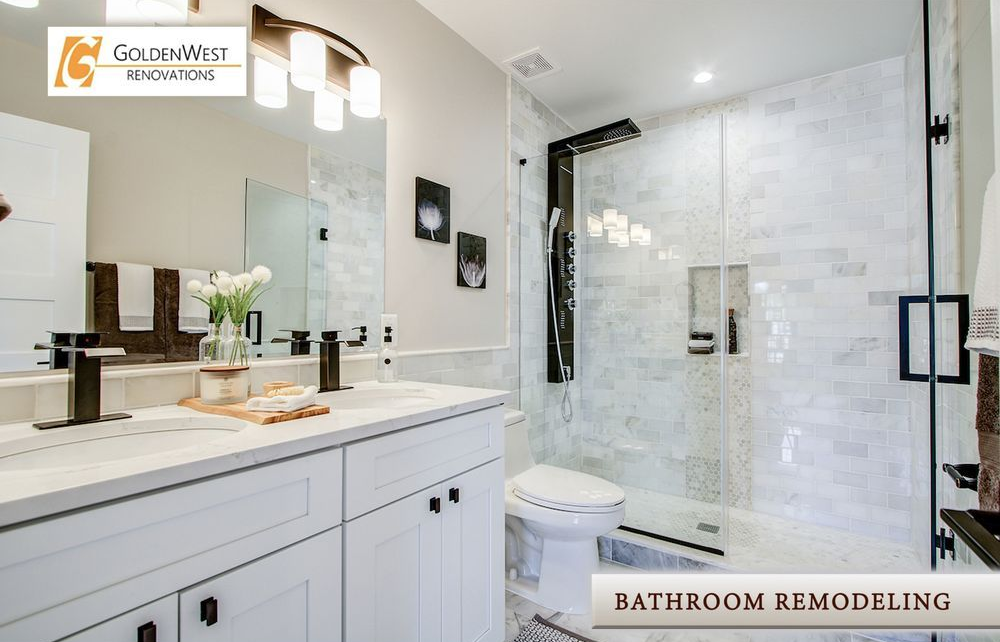 Bright white bathroom with double vanity, large mirror, and glass shower enclosure; bathroom remodeling sign.