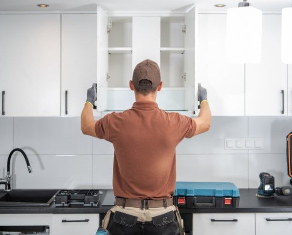 Man testing newly installed cabinets