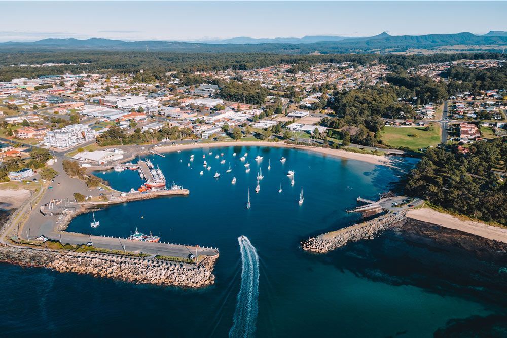Ulladulla Harbour on a Sunny Day with Boats and Calm Water — Optimum Towing in Ulladulla, NSW